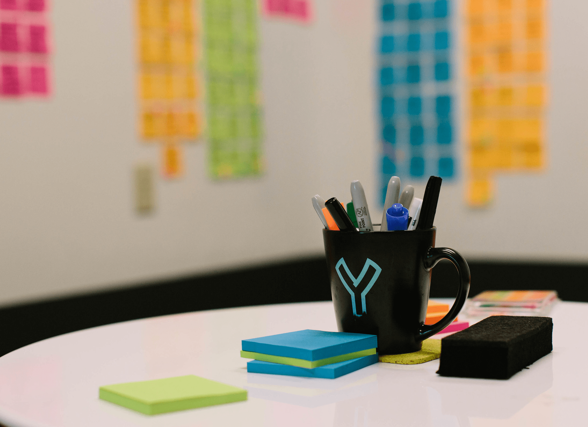Slingshot Mug on Table with Post It notes